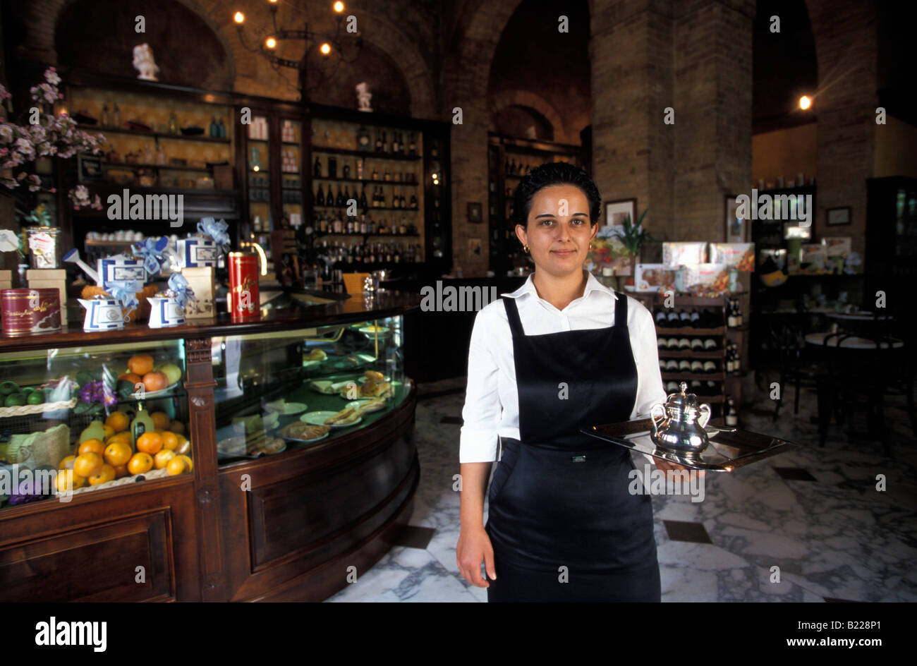 Waitress serving coffee Cafe Svizzero Cagliari Sardinia Italy Stock Photo