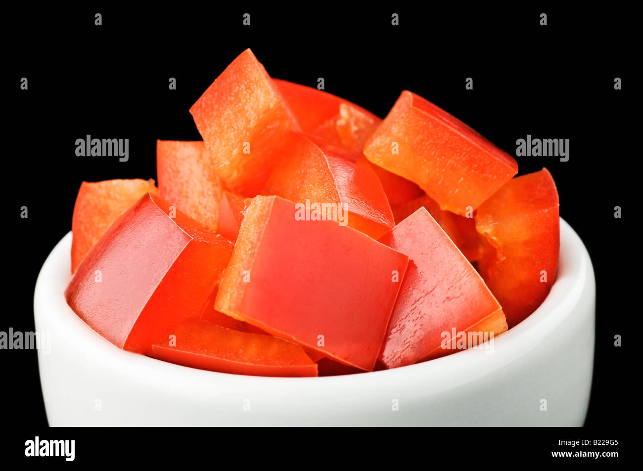 Diced red pepper in white pot Stock Photo Alamy