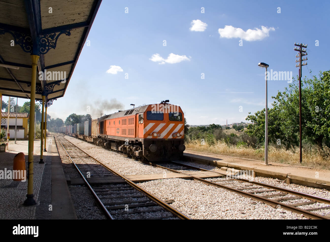 Diesel locomotive (model 1960 - bombardier) with a freight train from Comboios de Portugal. (Portuguese trains). Crato station. Stock Photo