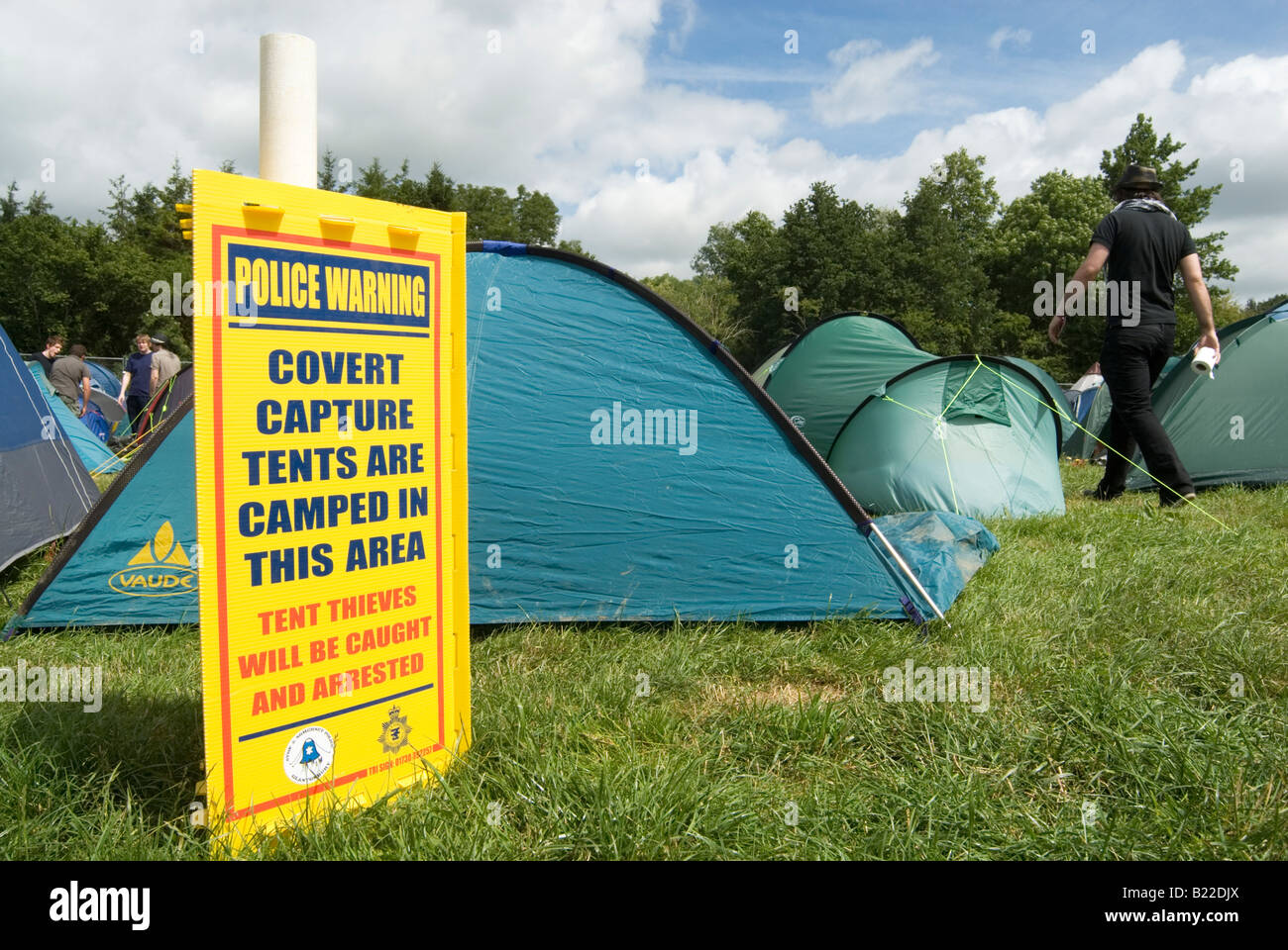 Police warning sign of covert capture tents at the Glastonbury festival Stock Photo