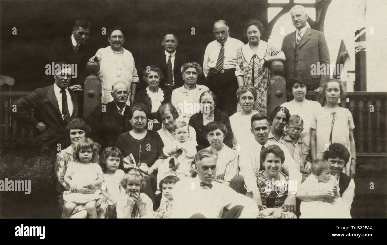 Circa 1940 family photo on porch of house. Stock Photo