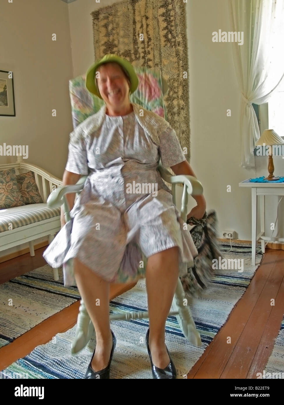 Old Lady Knitting In Rocking Chair