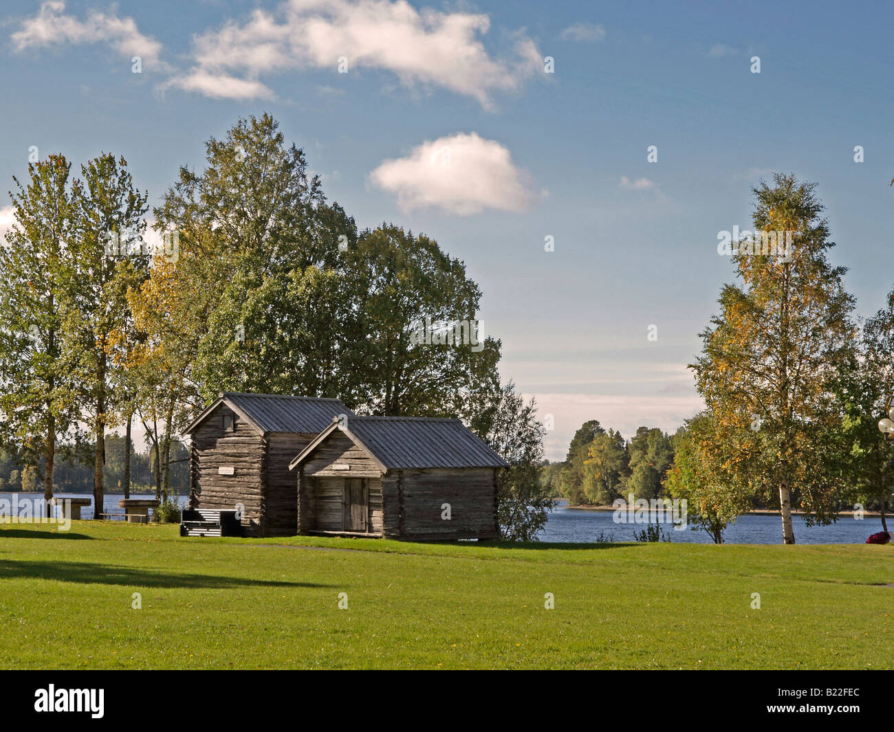 two wood cabins with a picnic place by the lake Dragan near the town ...