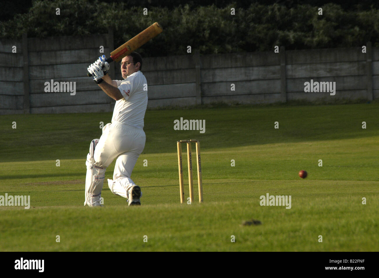 trying to bat at a local match Stock Photo