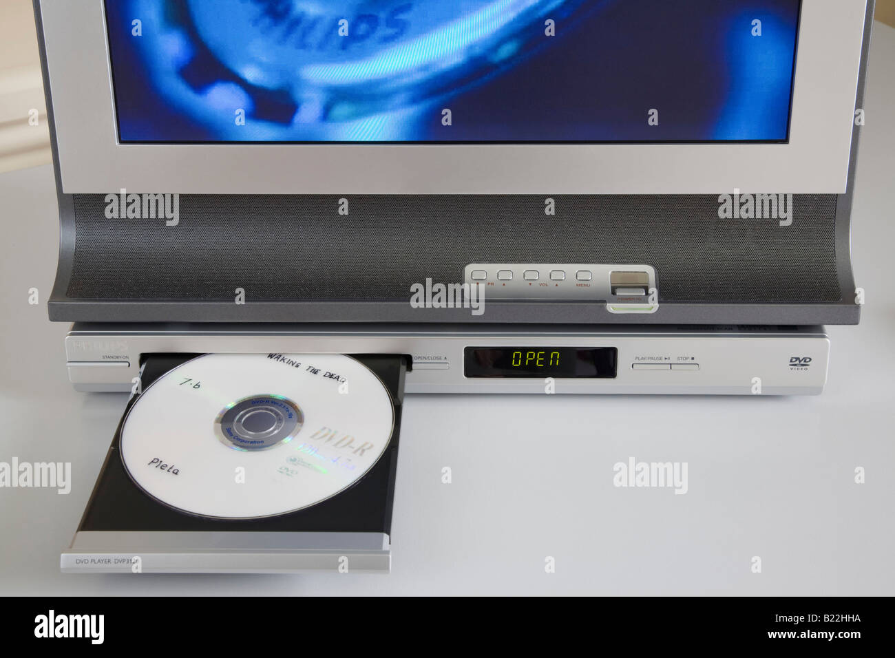 Homemade DVD in open drawer of player below a television Stock Photo - Alamy