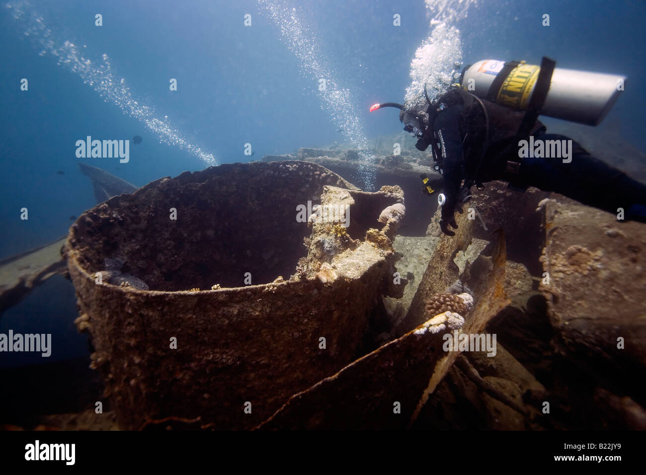 A scuba diver explores the wreck of the SS Thistlegorm in the Egyptian Red Sea. Stock Photo