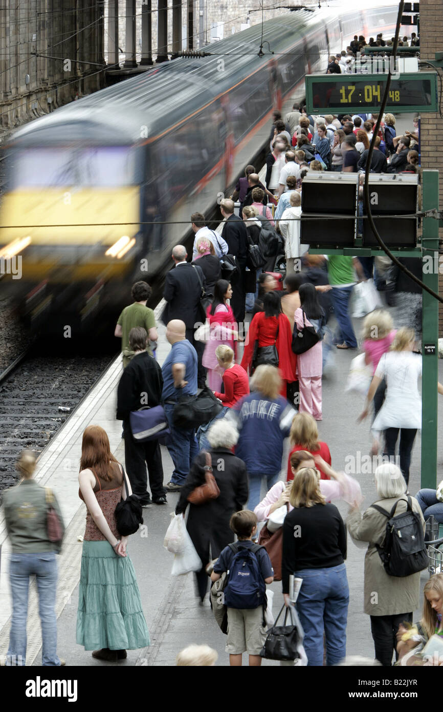 An elevated view of a busy platform at Edinburgh's Waverley station at