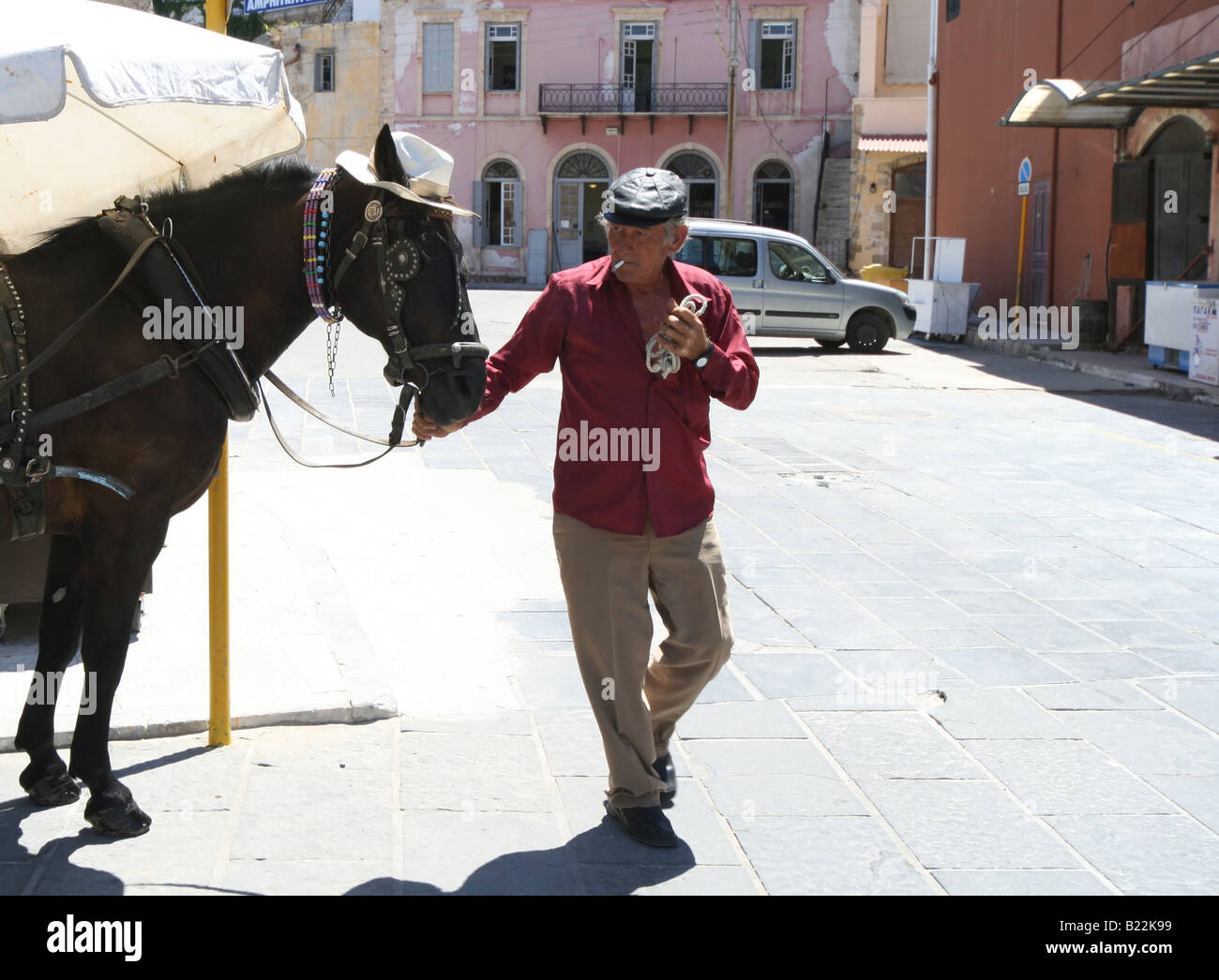 Old man and his horse at street of Chania (Crete, Greece) Stock Photo
