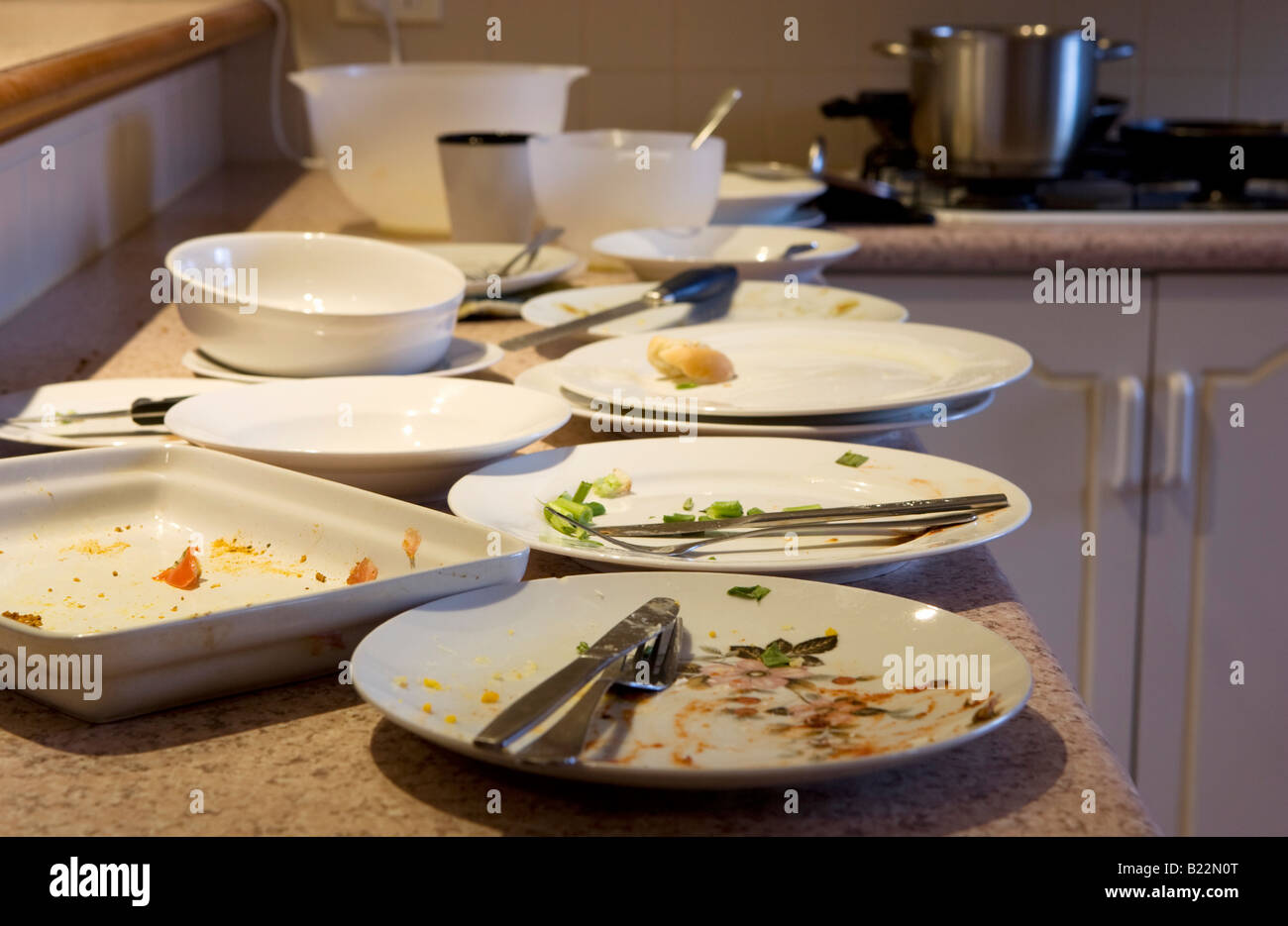 Dirty plates on a kitchen bench Stock Photo Alamy