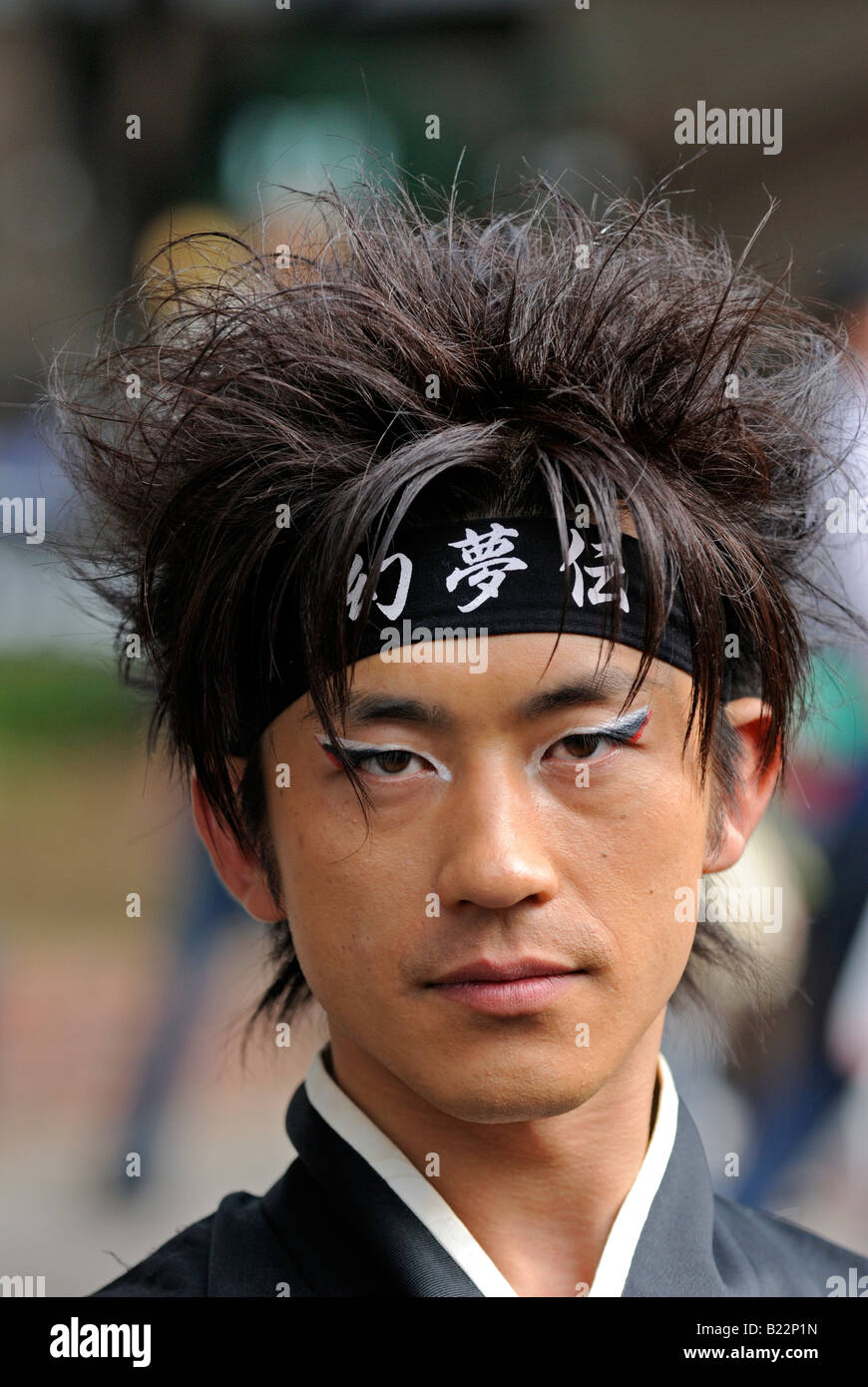 Japanese Dancer With Headband And Painted Face At Michinoku
