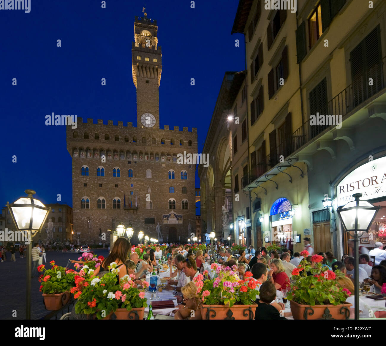 Restaurant in front of the Palazzo Vecchio at night, Piazza della Signoria, Florence, Tuscany, Italy Stock Photo
