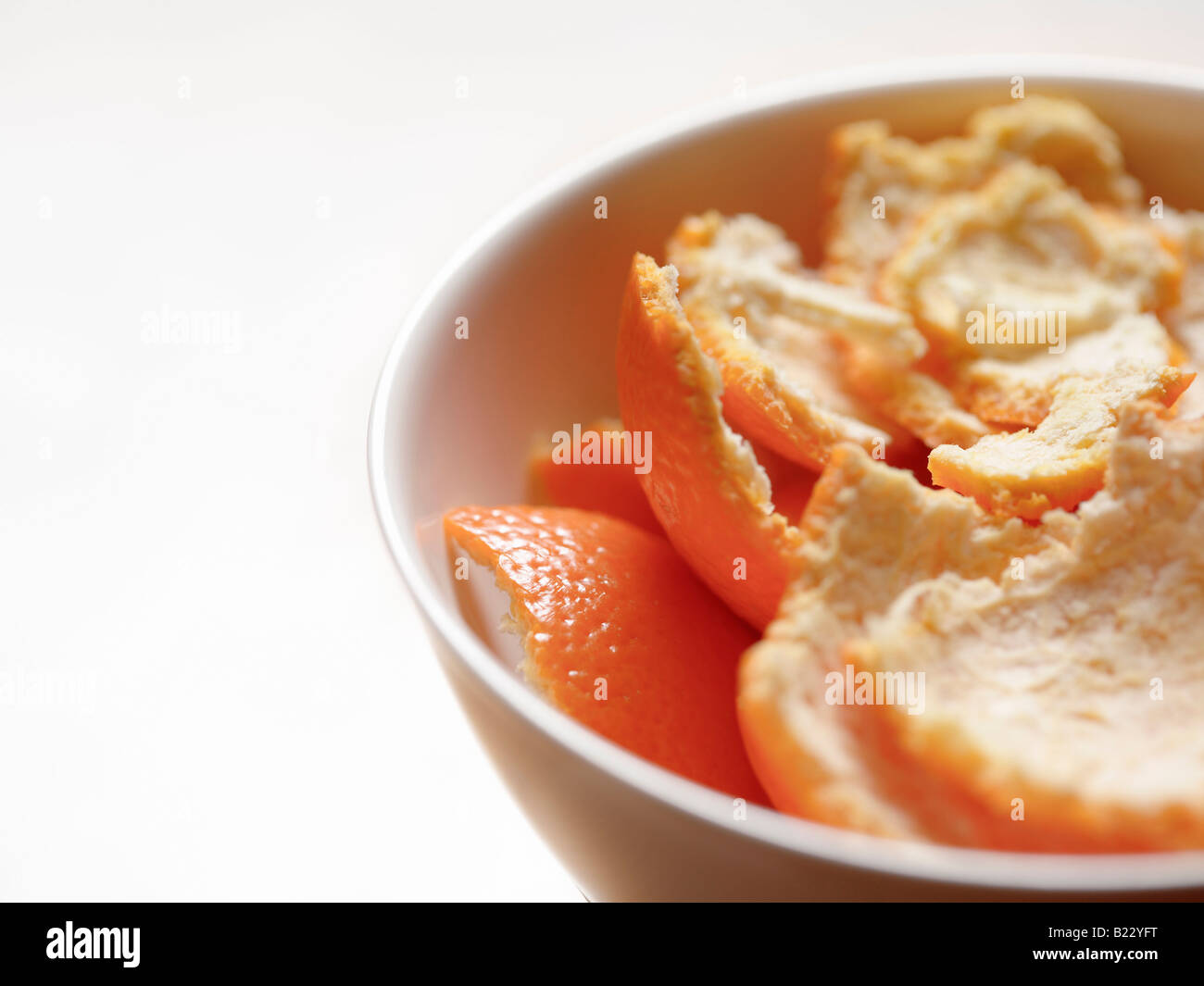 Bowl filled with orange peel Stock Photo