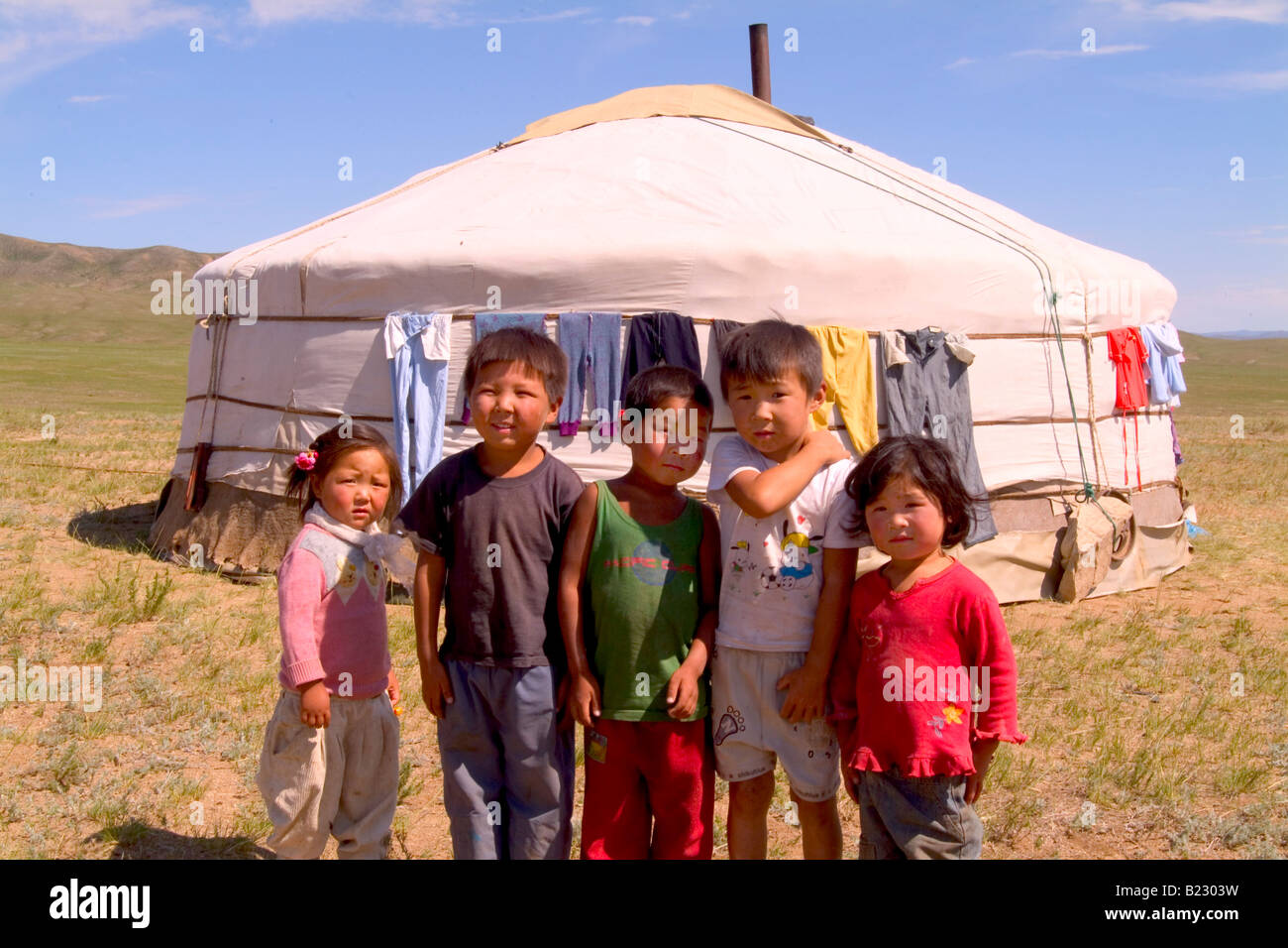 Nomadic children standing in front of yurt, Ulan Bator, Independent Mongolia Stock Photo