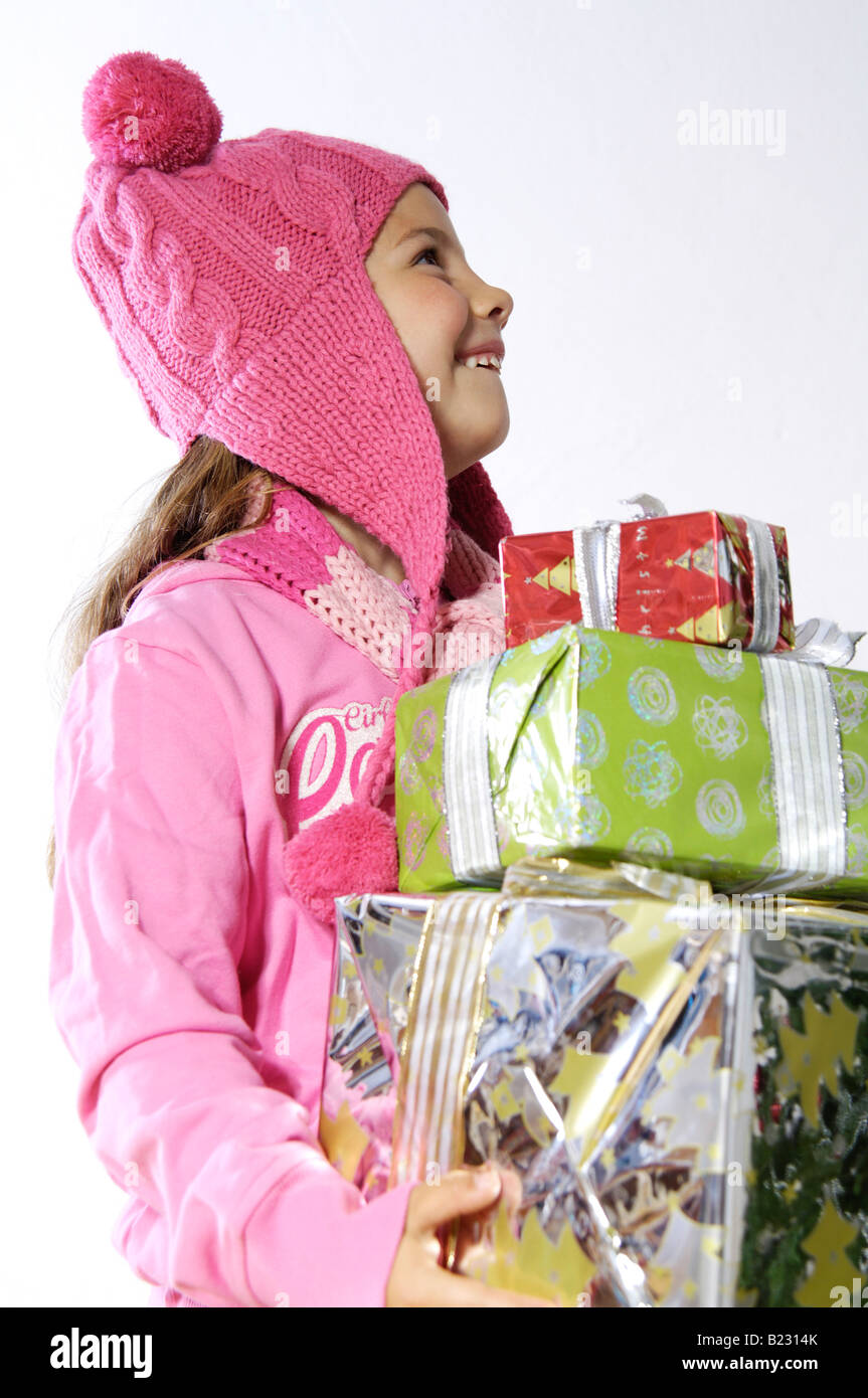 Close-up of girl holding christmas gifts and smiling Stock Photo - Alamy