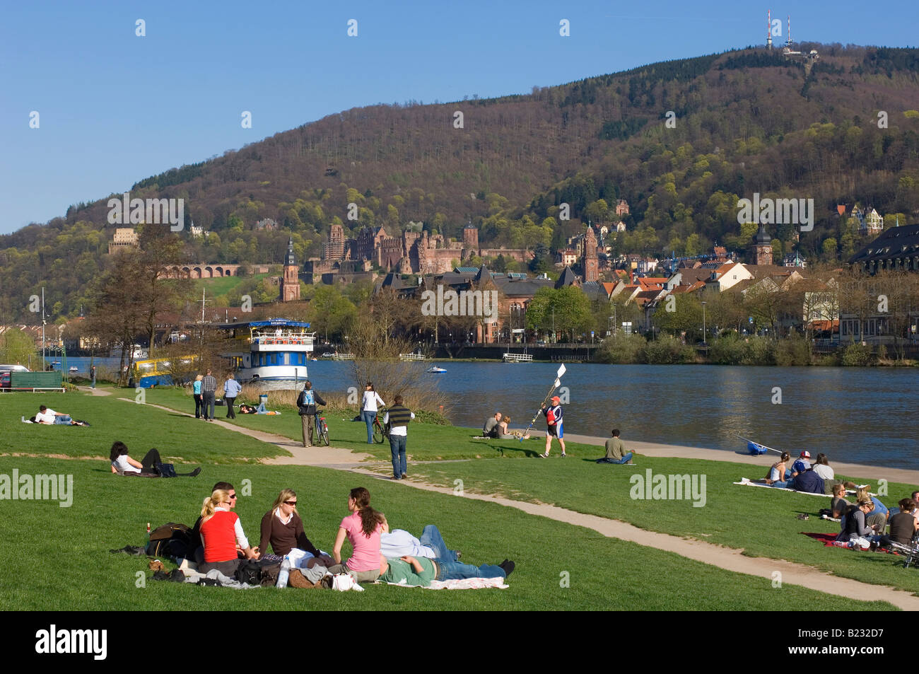 Tourists relaxing on riverside Heidelberg Germany Stock Photo - Alamy