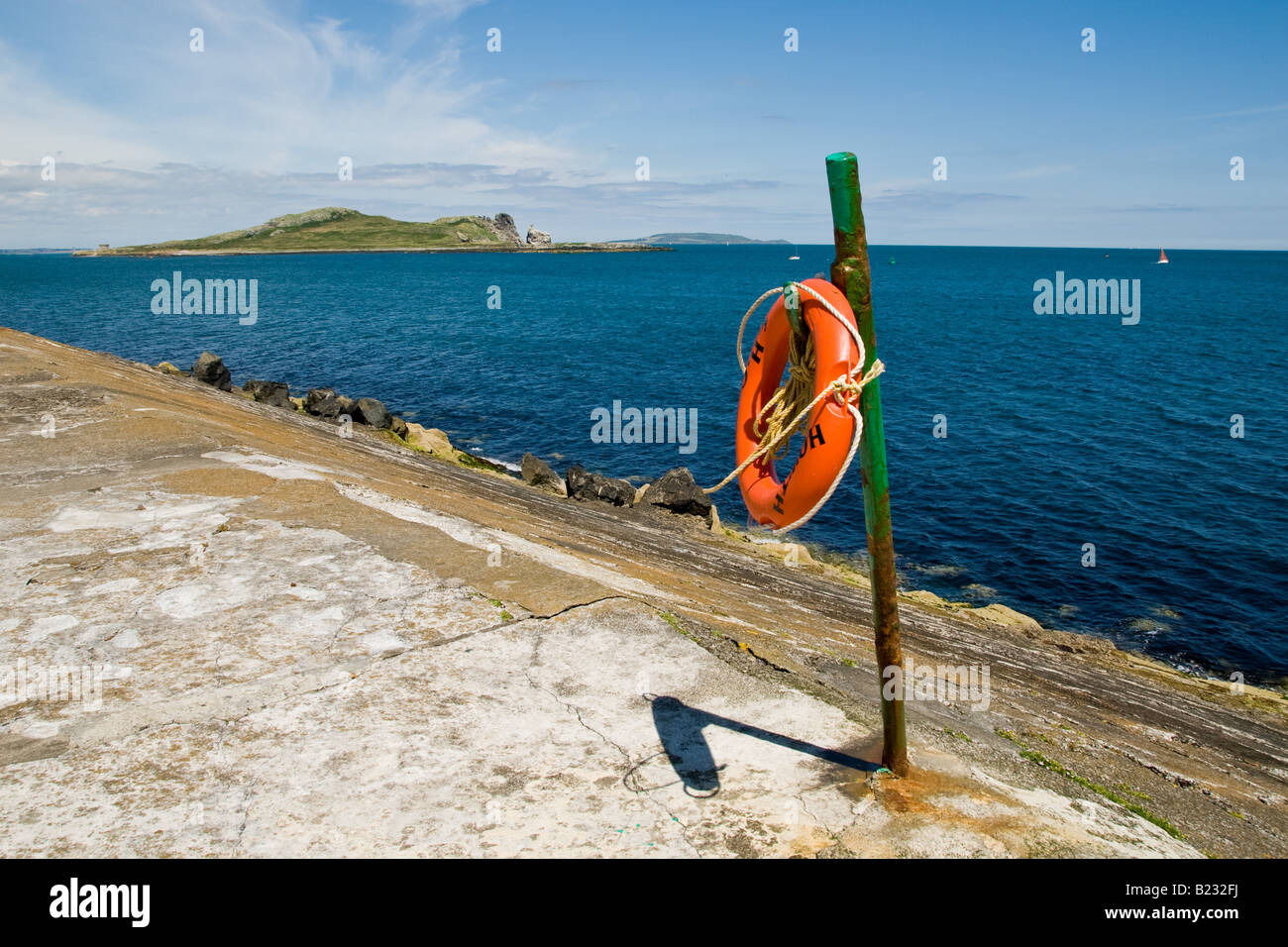 Lifeboy at Howth harbour looking towards Irelands Eye Island Dublin Ireland Stock Photo