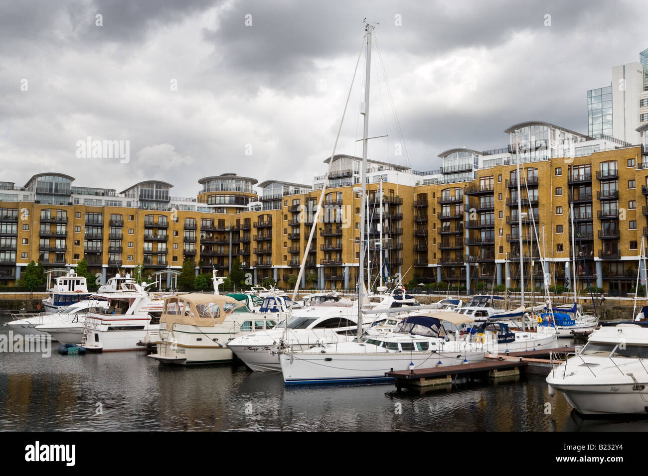 Yachts moored at St Katharine's Dock marina in London. Stock Photo