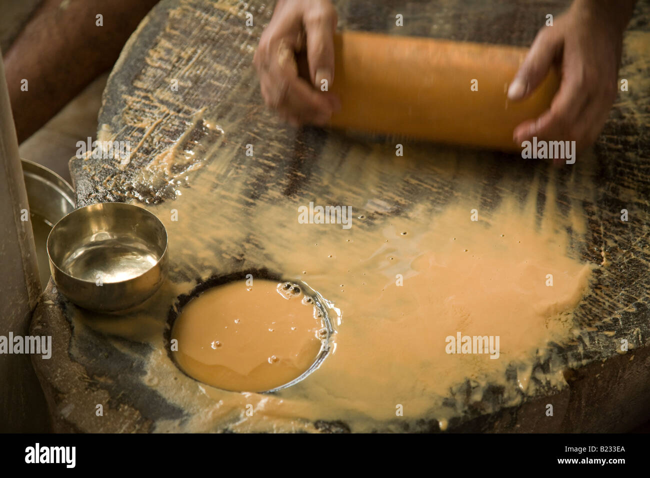 Sandalwood paste being prepared inside the Shri Adishwarji Jain temple in the Walkeshwar district of Mumbai, Maharastra, India Stock Photo