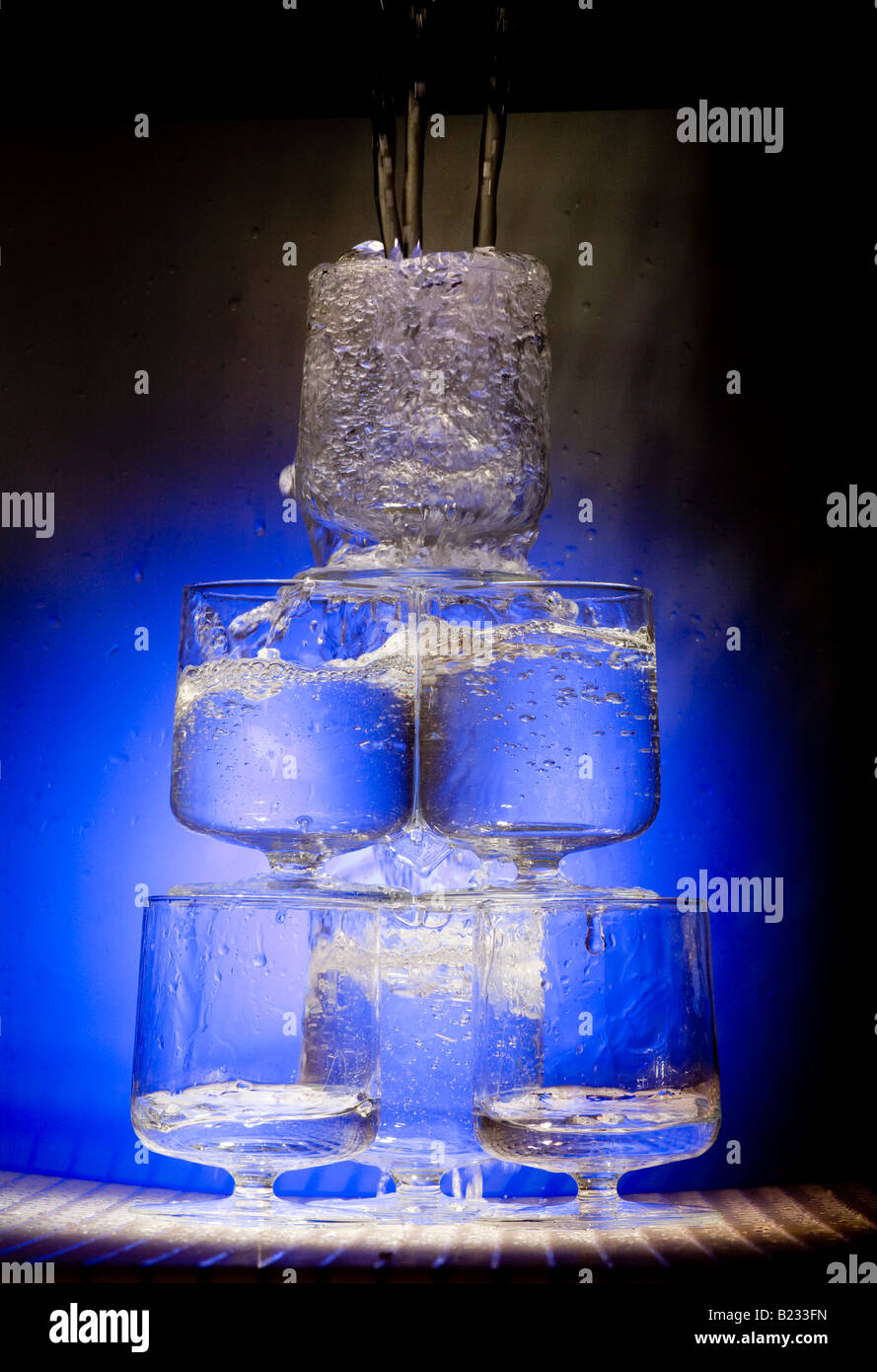 Water pours into glass Stock Photo