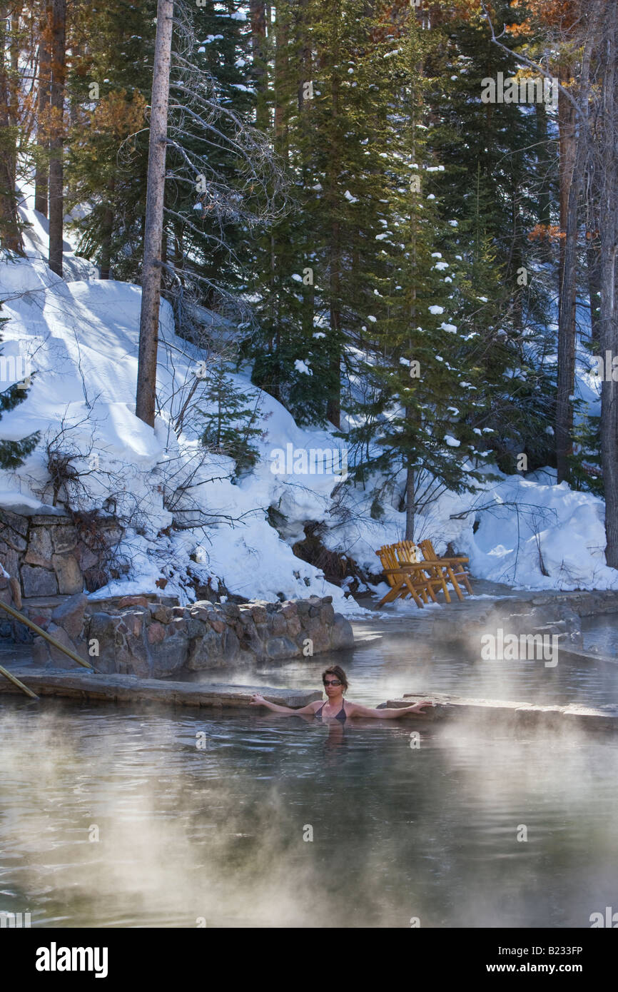 A girl enjoys a soak in the hot springs near Steamboat Springs, Colorado, USA. Stock Photo