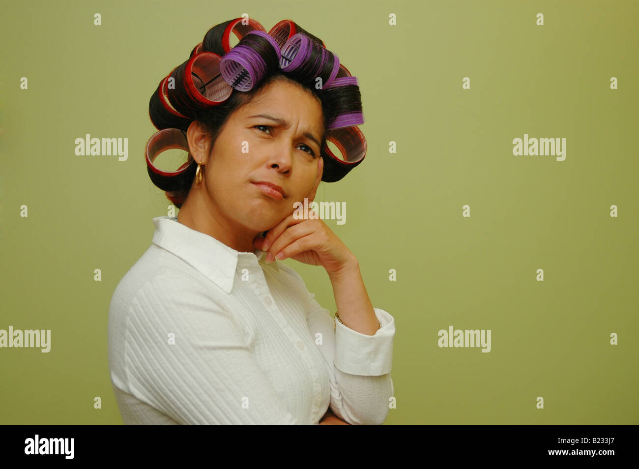 Woman wearing hair rollers Stock Photo Alamy