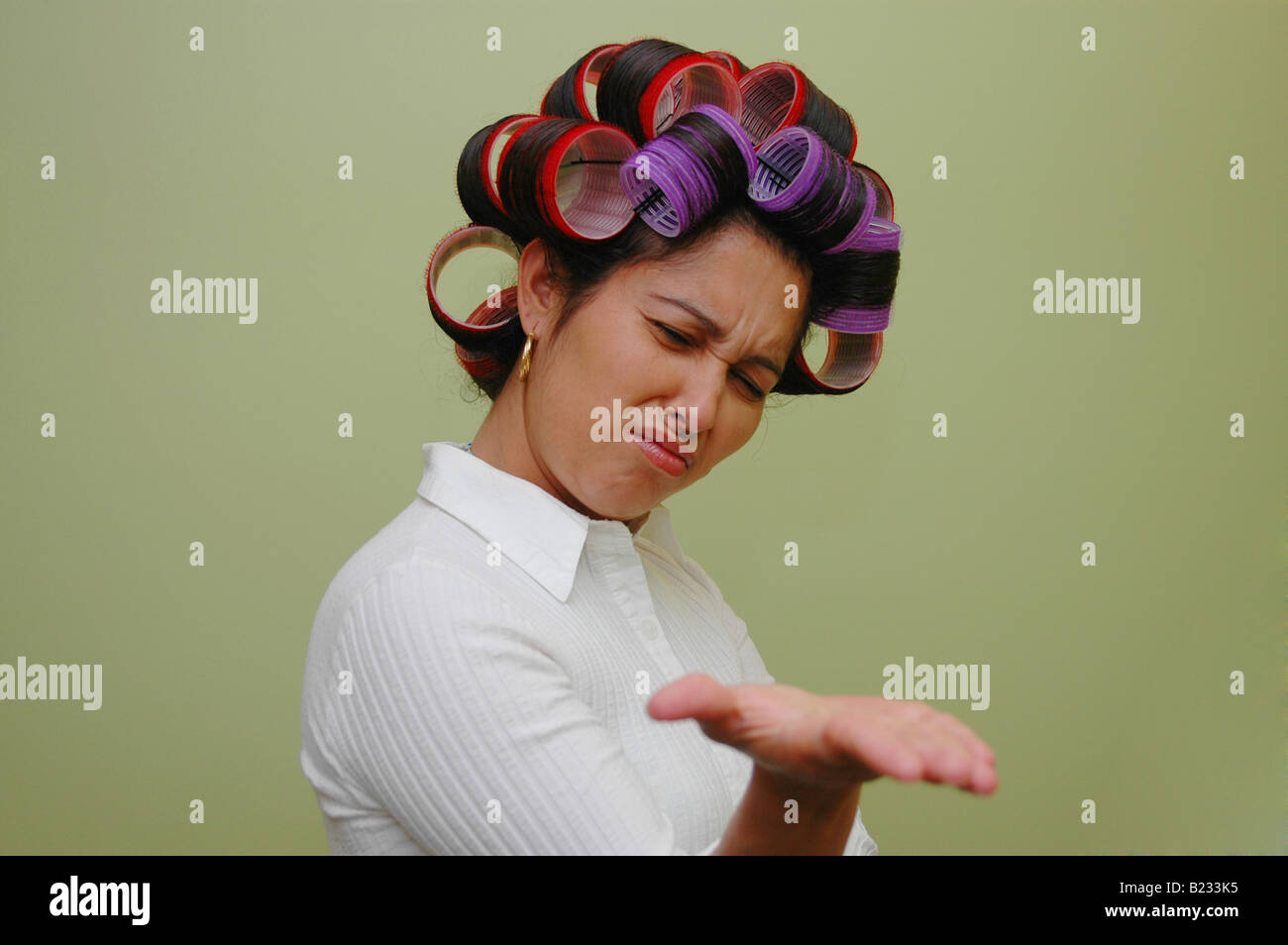 Woman wearing hair rollers Stock Photo Alamy