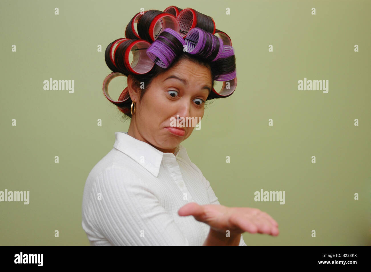 Woman wearing hair rollers Stock Photo Alamy