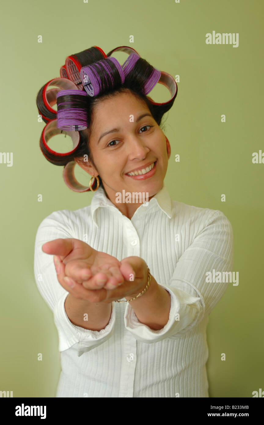Woman wearing hair rollers Stock Photo Alamy