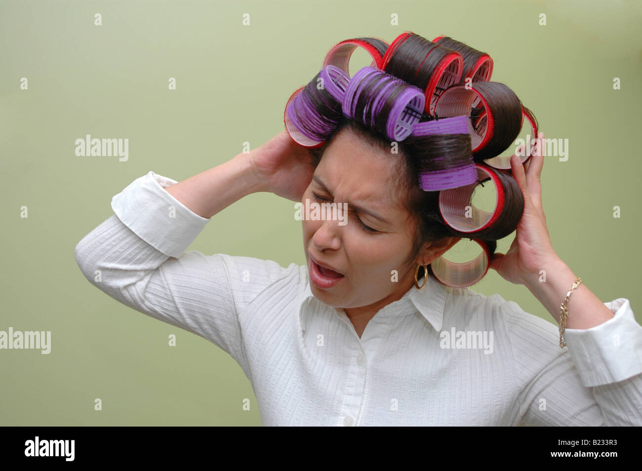 Woman wearing hair rollers Stock Photo Alamy