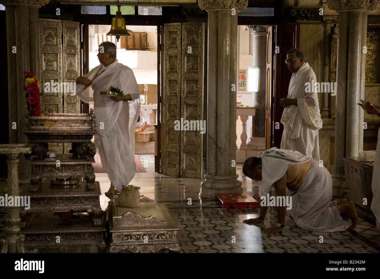Devotees inside the Shri Adishwarji Jain temple in the Walkeshwar area of Mumbai, Maharastra, India Stock Photo