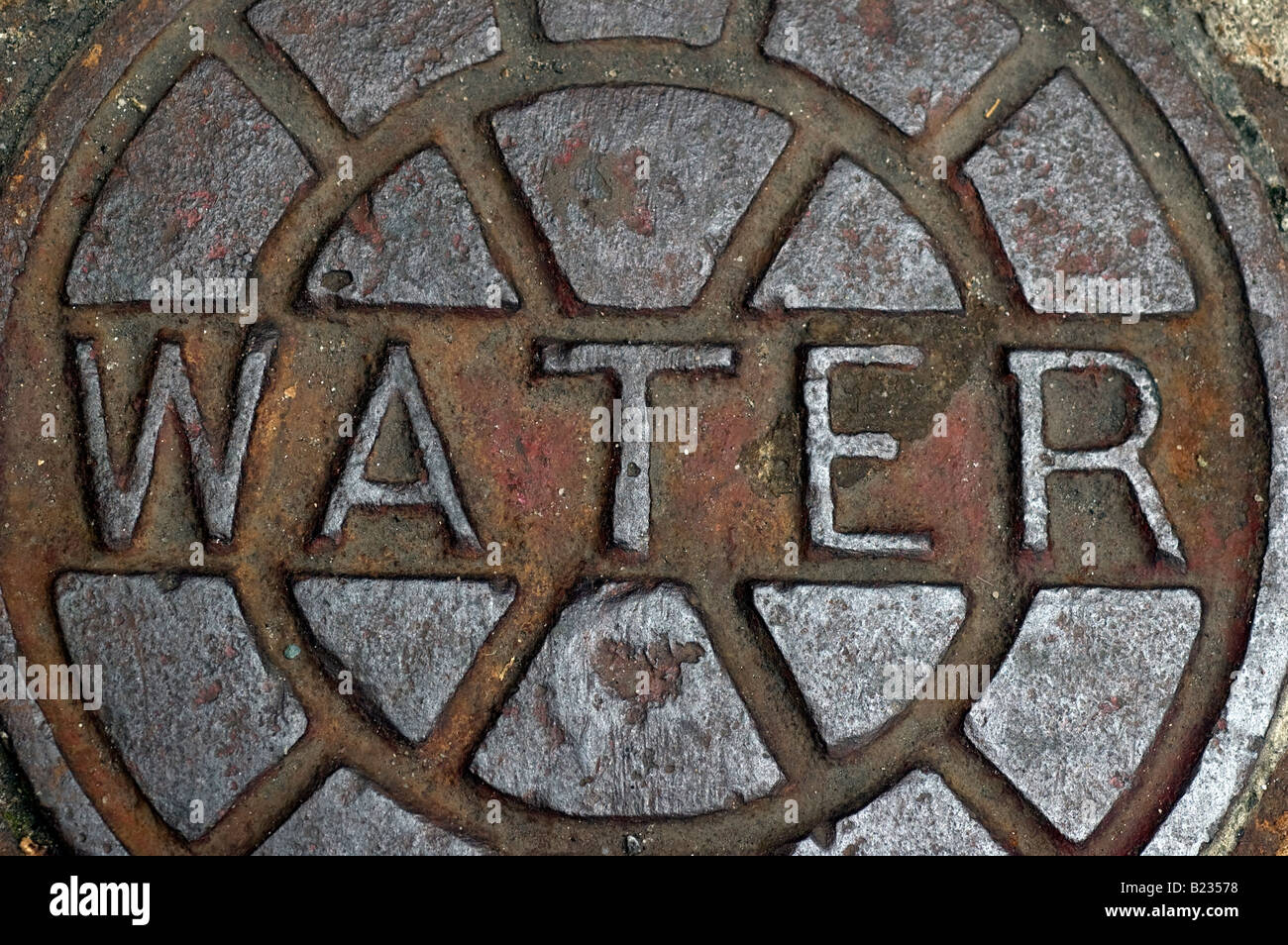 Close up of manhole cover for water main pipe Stock Photo
