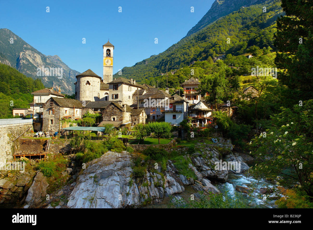 Rustic mountain village of Lavertezza with stone houses and church -Val Verzasca, Ticino, Alps, Stock Photo