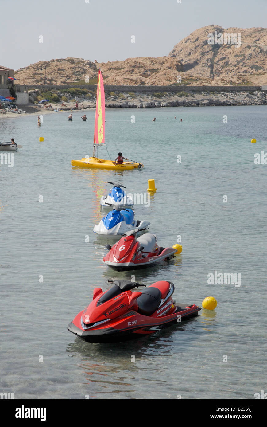 Sports and leisure boats and jetskies on the beach and moared in the