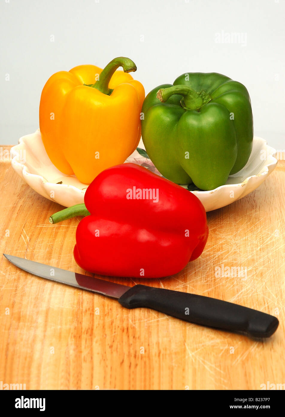 Peppers on the Cutting Board Stock Photo - Alamy