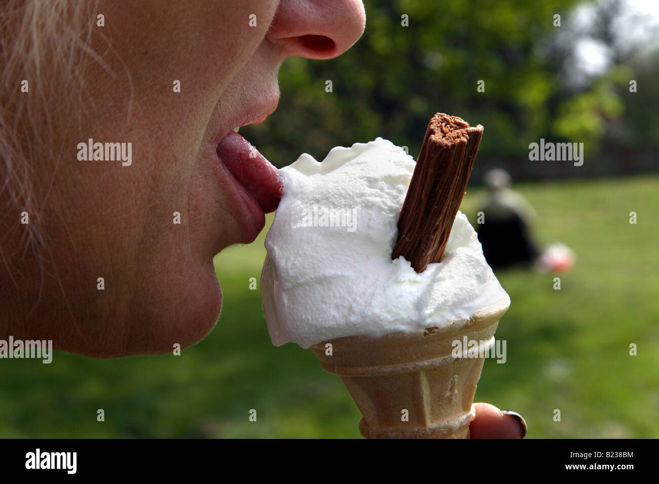 Woman licking ice cream Stock Photo Alamy