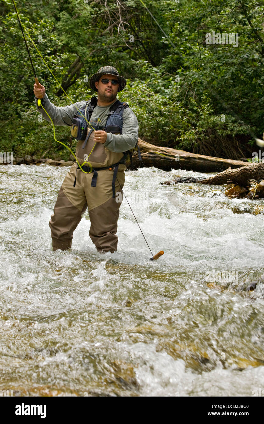 Man fly fishing along the Rio Hondo near Taos New Mexico Stock Photo