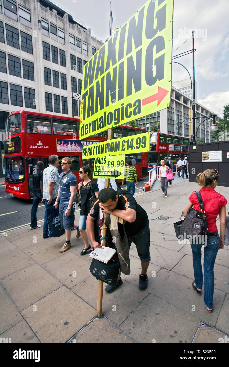 Sandwich board man oxford street hi-res stock photography and