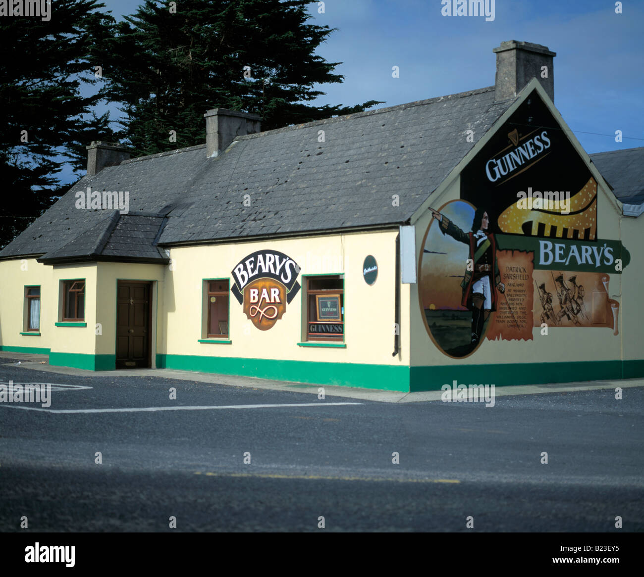 colourful/colorful irish roadside pub/bar, advertising the national drink on its gable end Stock Photo