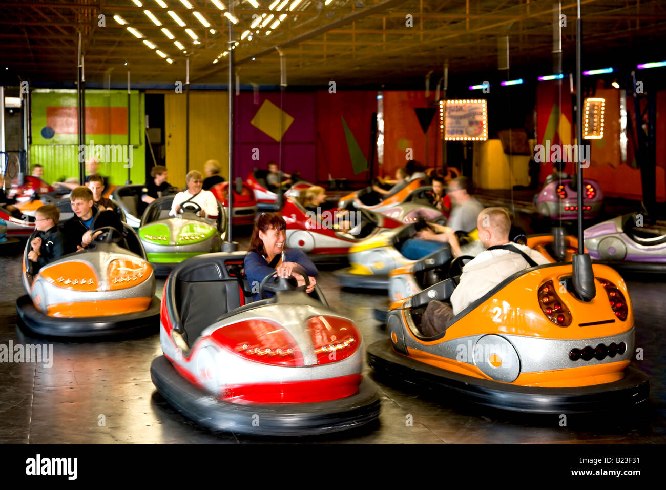 Driving bumper cars in Bakken amusement park Stock Photo Alamy