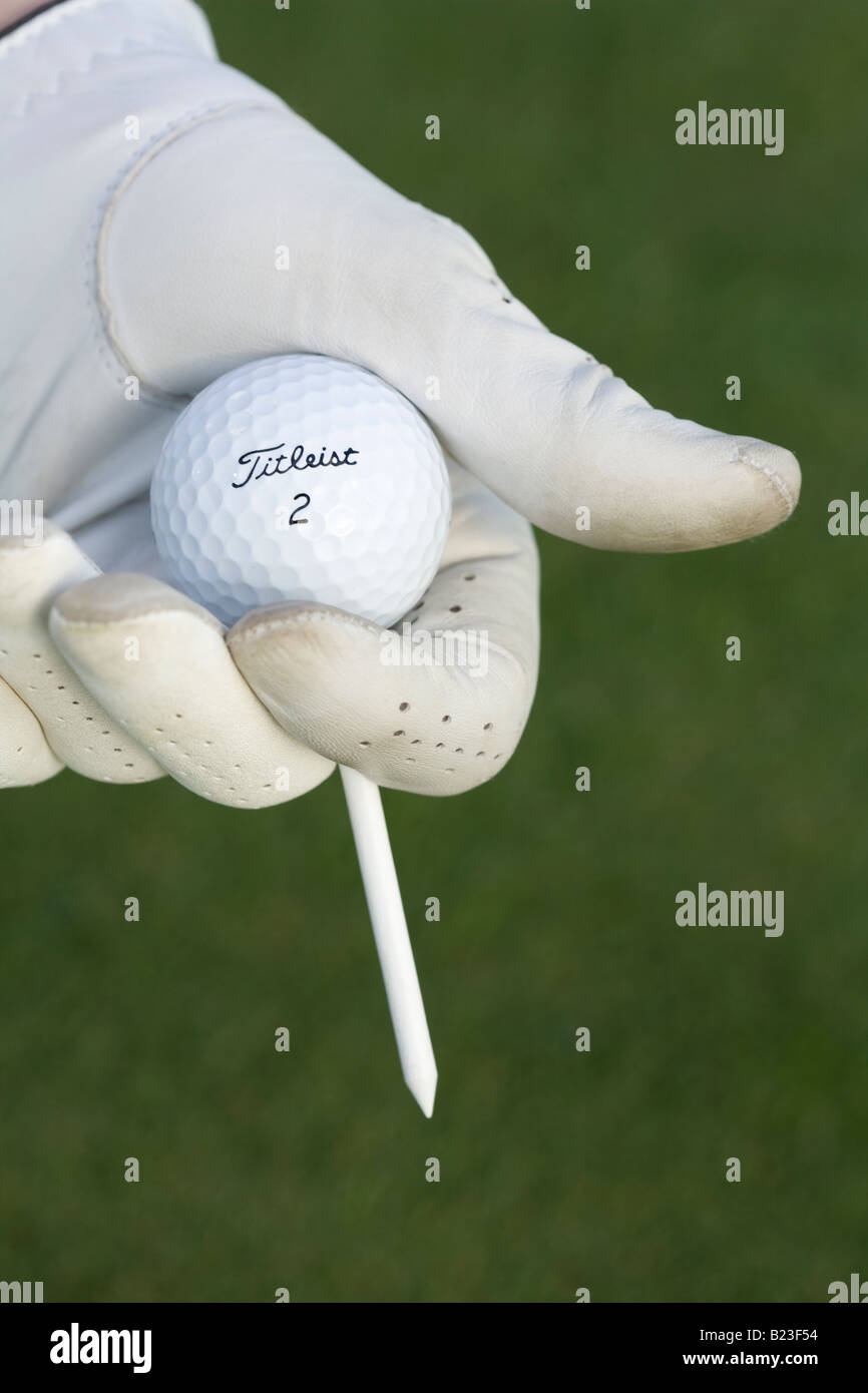 Golfer about to tee up golf ball Stock Photo Alamy