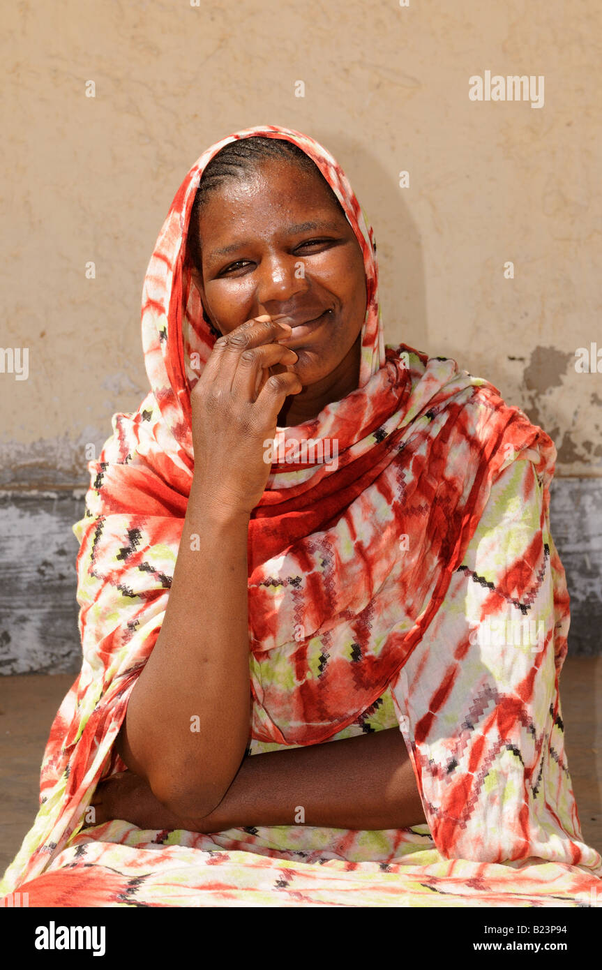 Friendly happy woman with scarf and traditional dress looking in the camera  Banc d arguin Western Africa Mauritania Africa Stock Photo - Alamy