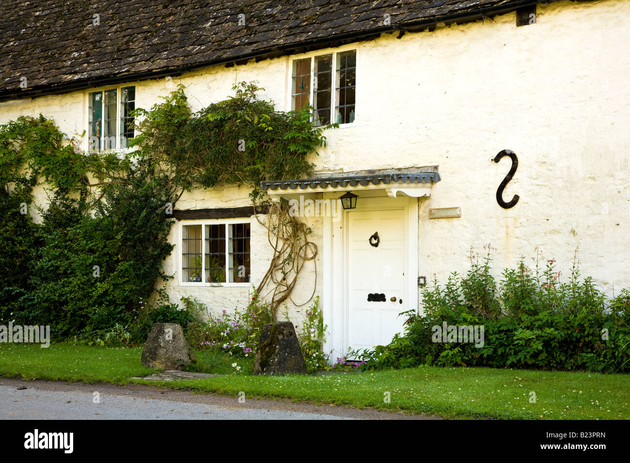The Long House, a typical English country cottage in the Cotswold village of Ashton Keynes, Wiltshire, England, UK Stock Photo