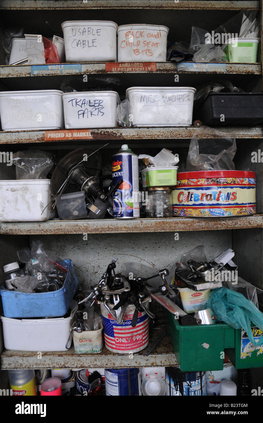 Shelves containing spare parts and tools in a bike repair shop Stock Photo