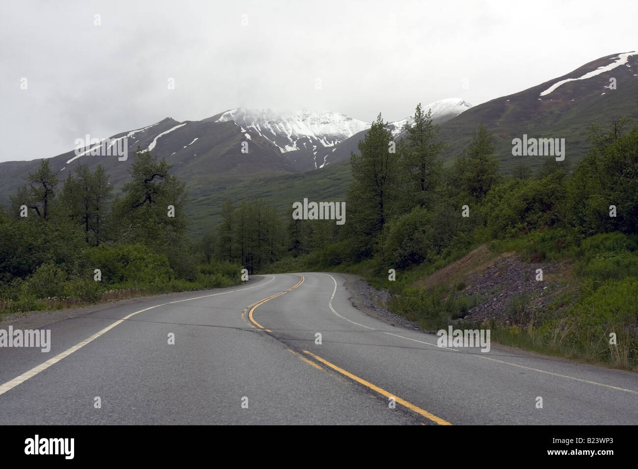 Winding road to nowhere in Alaska, USA Stock Photo