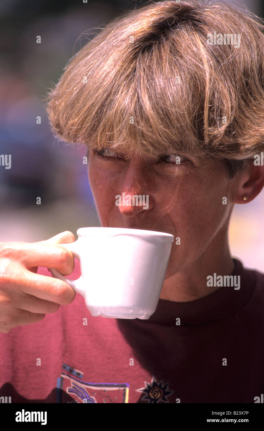 WOMAN DRINKING WATER TEA COFFEE Stock Photo Alamy