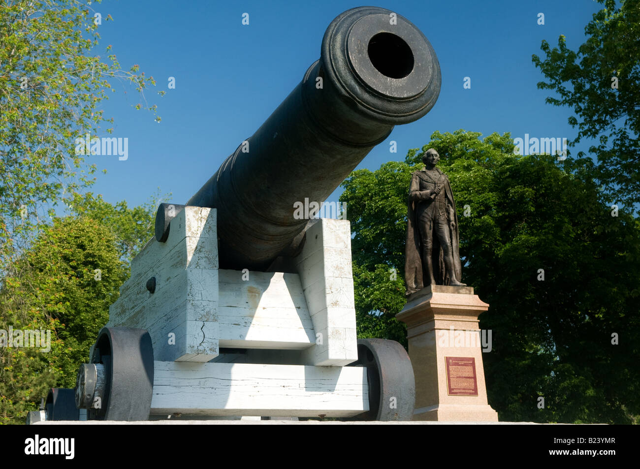 A memorial of Canada's first Prime Minister Sir John A MacDonald with period Cannons in Kingston, Ontario, Canada. Stock Photo