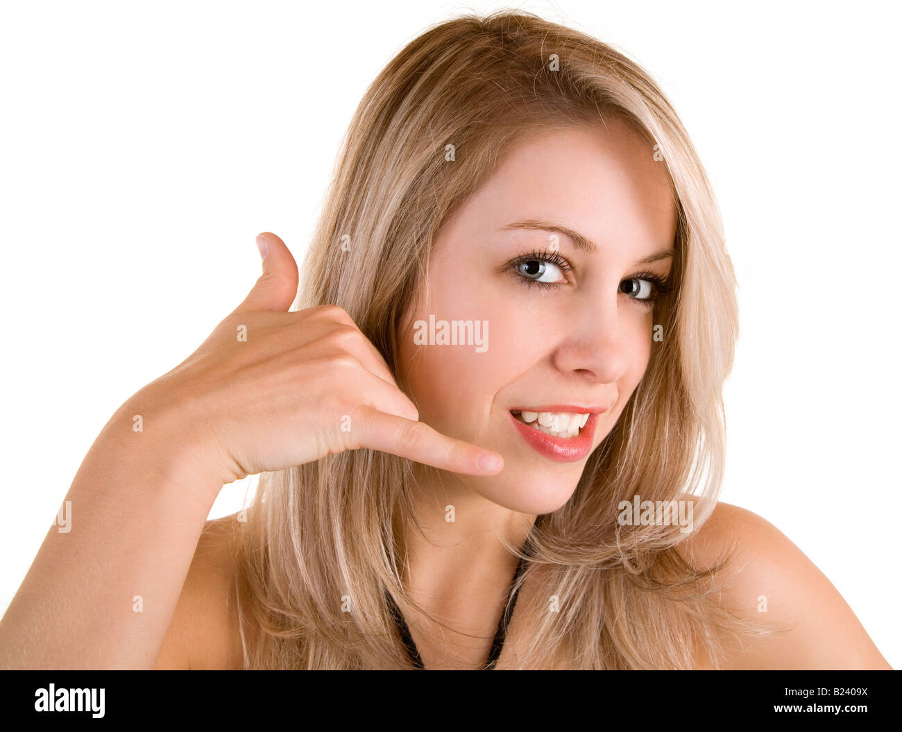 A beautiful blonde lady is doing a call me sign Stock Photo - Alamy