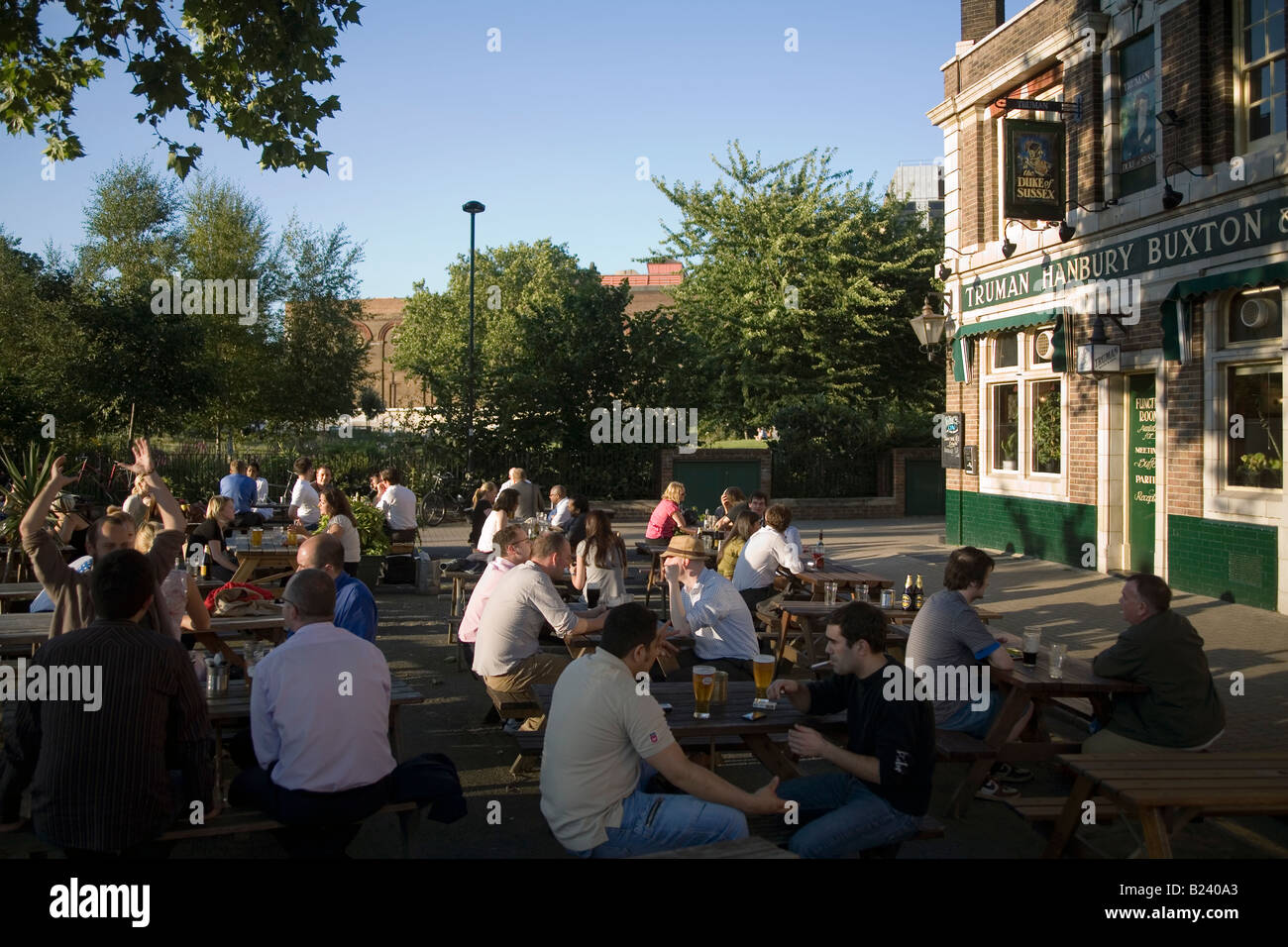 People sitting outside in a London pub England Britain UK Stock Photo