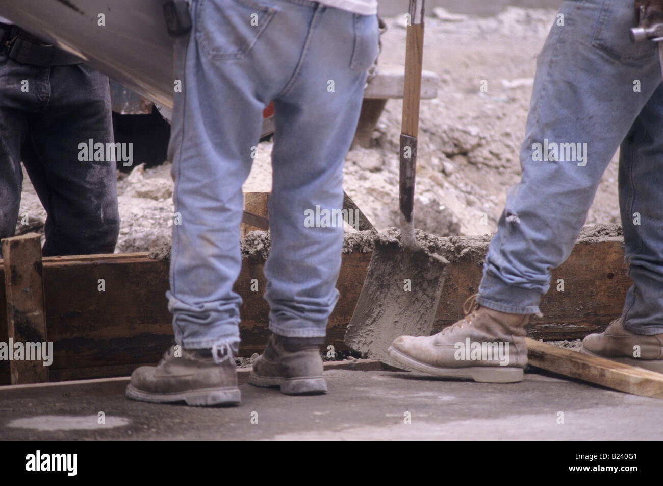 Construction workers boots. Dirty and ready to get to work Stock Photo