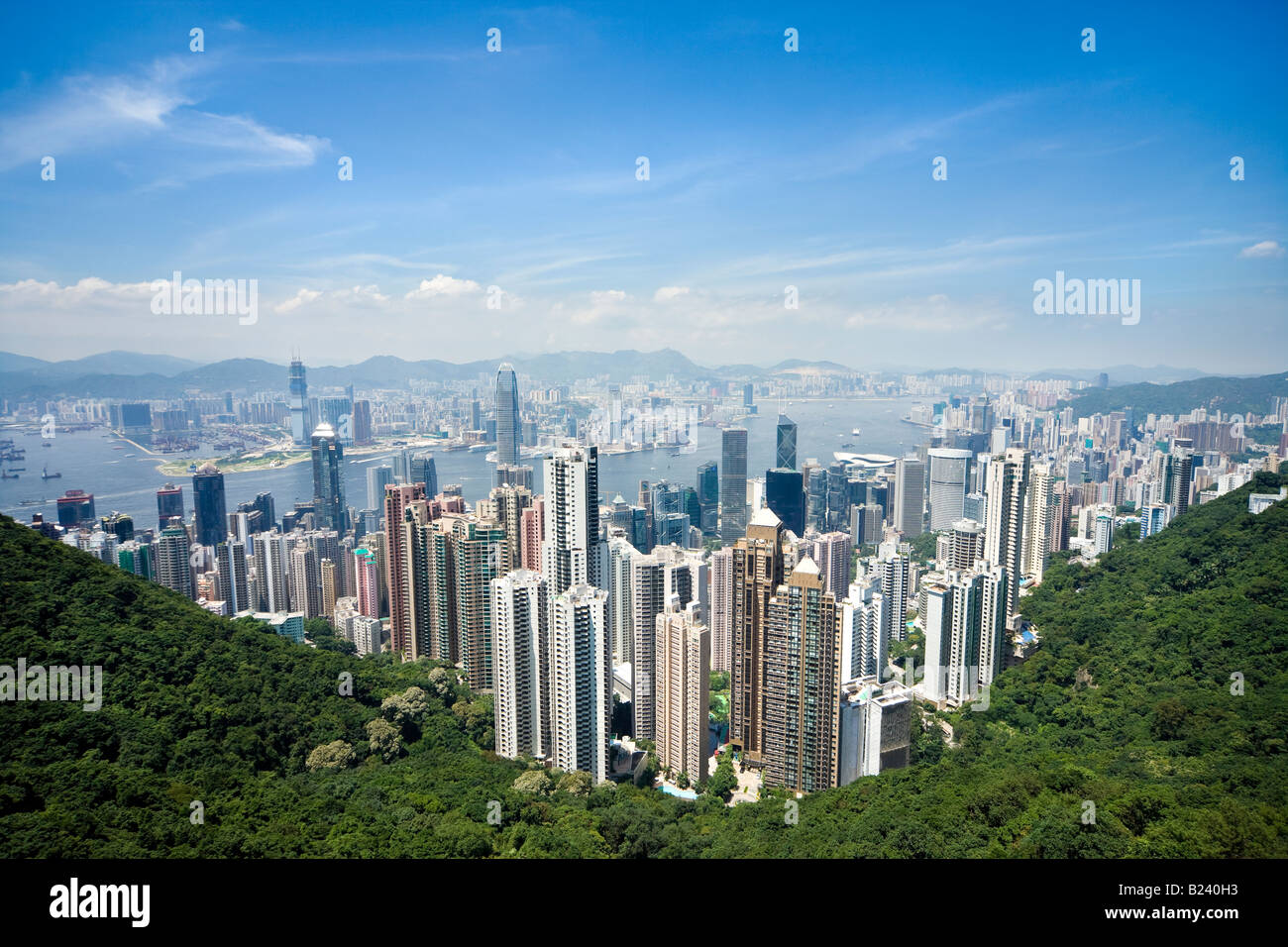 Hong Kong skyline. Panoramic view of Hong Kong and Kowloon from Victoria Peak Tower. Hong Kong, China, SAR, on a clear and sunny day. Stock Photo